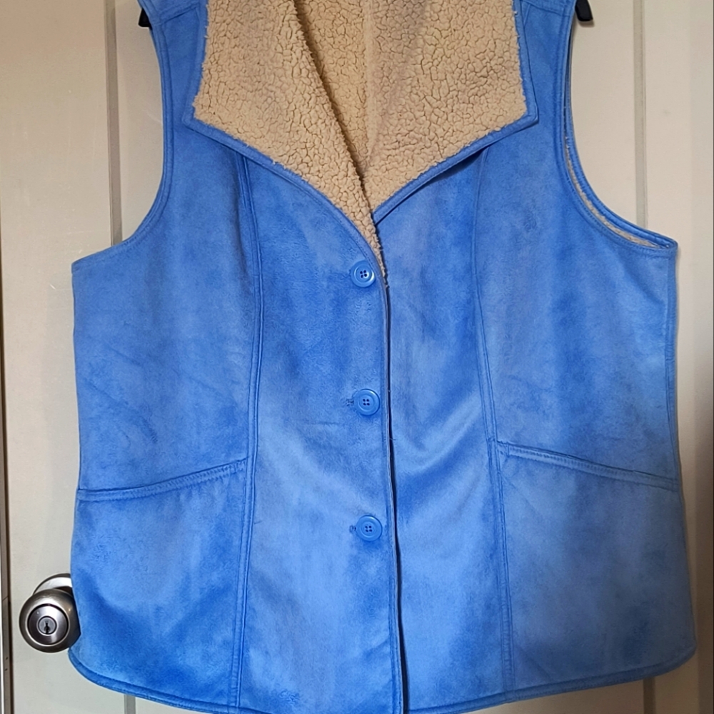 Beautiful lt. Blue faux suede and shearling vest. No flaws no marks,